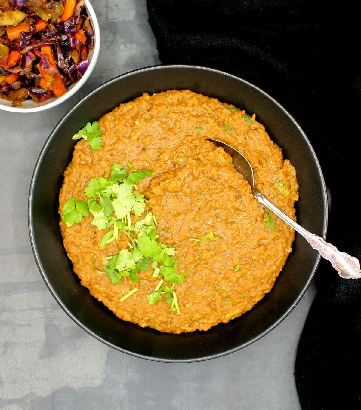 Misir Wot Ethiopian spiced red lentil stew on injera, a boldly spiced plant-based dish from Ethiopia