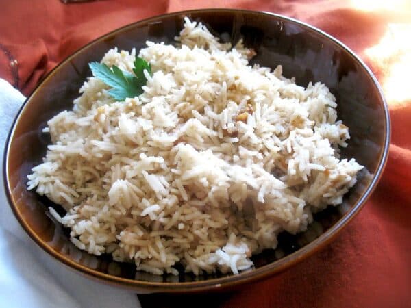 Zimbabwean Peanut Butter Rice served in a bowl, a Southern African rice dish cooked with groundnut paste and spices
