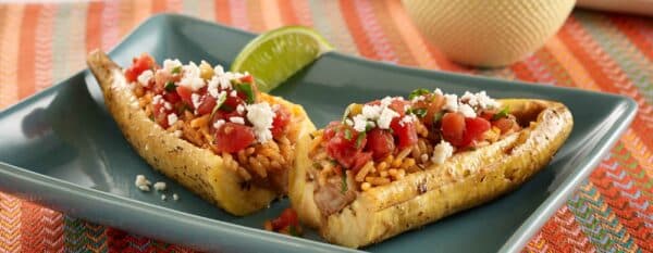 Sweet Stuffed Moroccan Chicken on a serving plate with almond and raisin filling, a fragrant North African celebratory dish