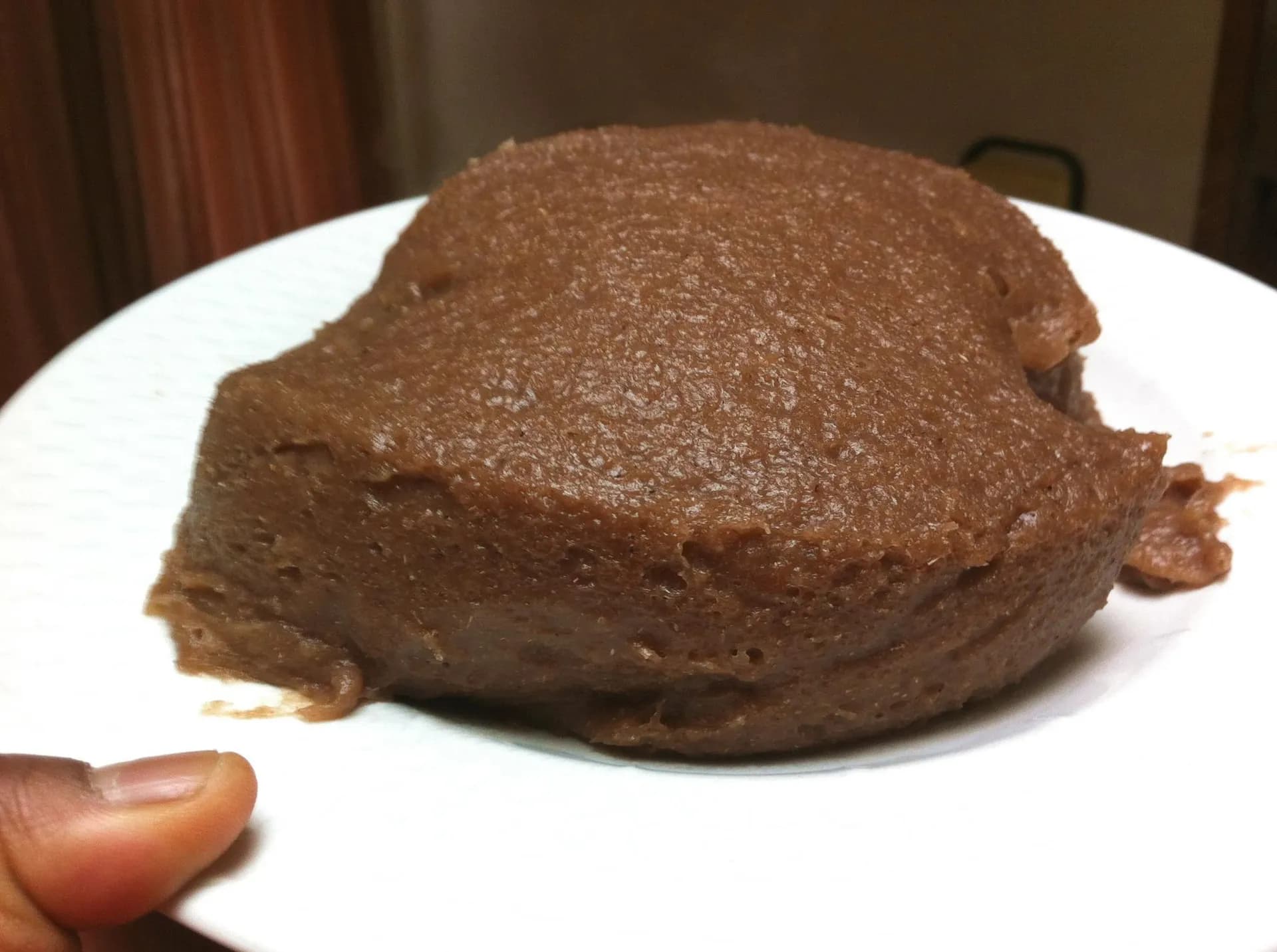 Amala, a dark Yoruba yam flour swallow from Nigeria, served with ewedu and stew