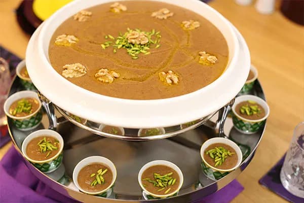 Asida, a Libyan cooked flour pudding with date paste, saffron and walnuts