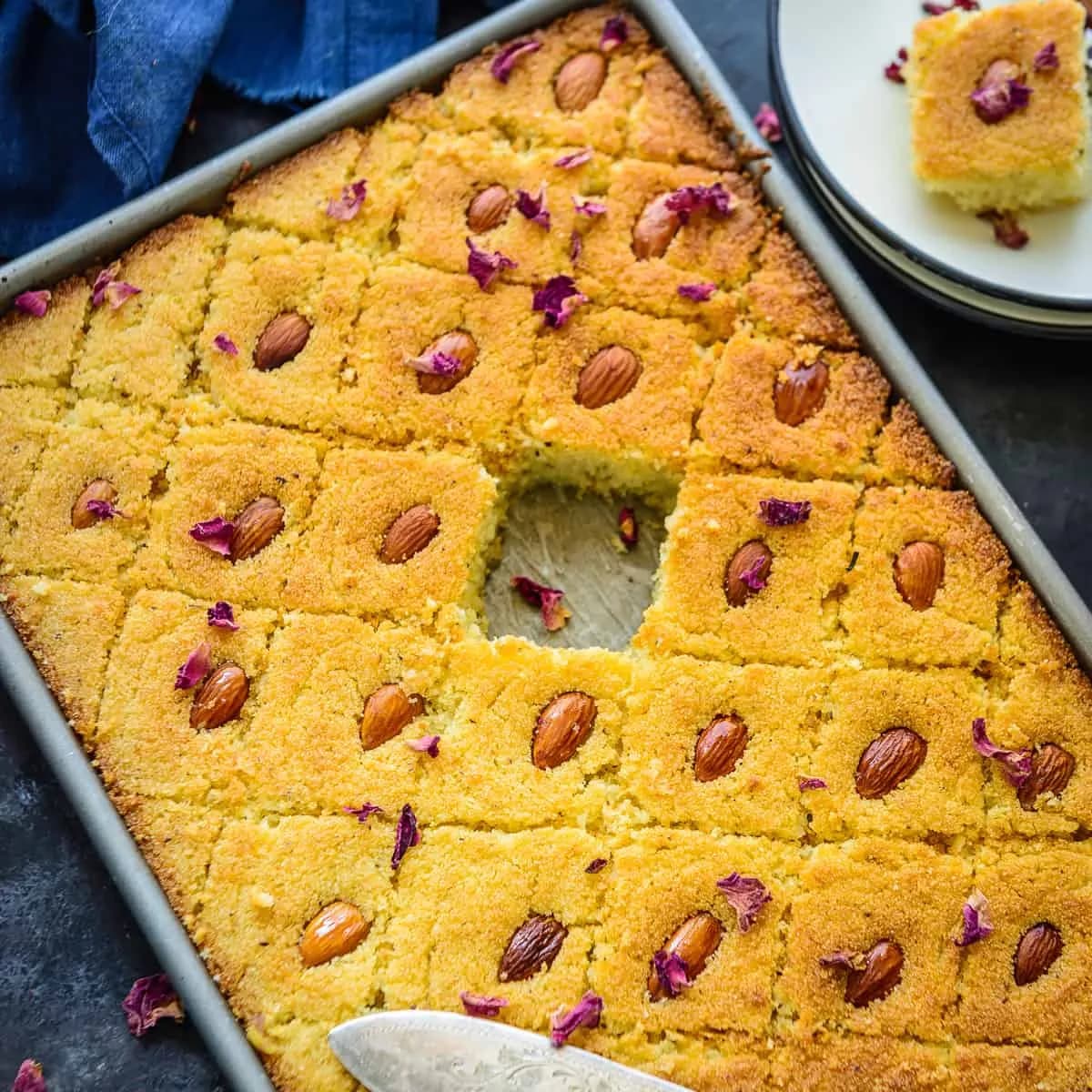 Basbousa, an Egyptian semolina cake cut into diamonds with almonds and syrup