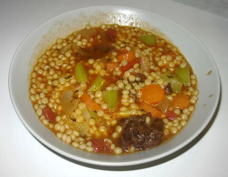 Berkoukes, an Algerian stew of hand-rolled semolina pasta balls with beef and vegetables