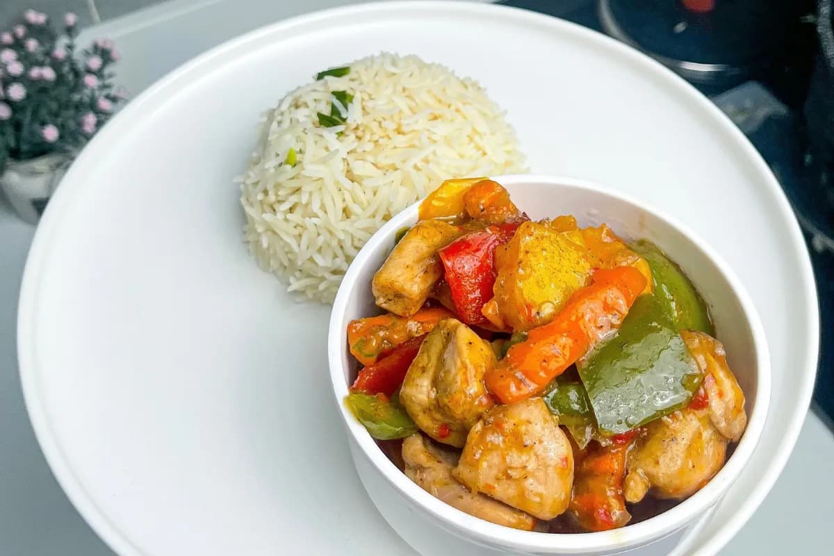 Chicken curry sauce with carrots and bell peppers in a glossy Nigerian sauce