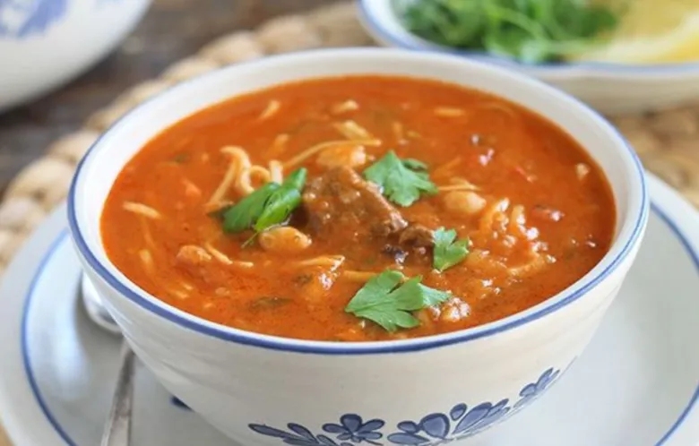 Chorba, a Tunisian soup of lamb and frik in a spiced tomato base