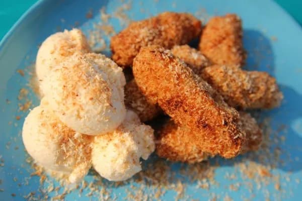 Crunchy fried bananas in a coconut coating, served with ice cream