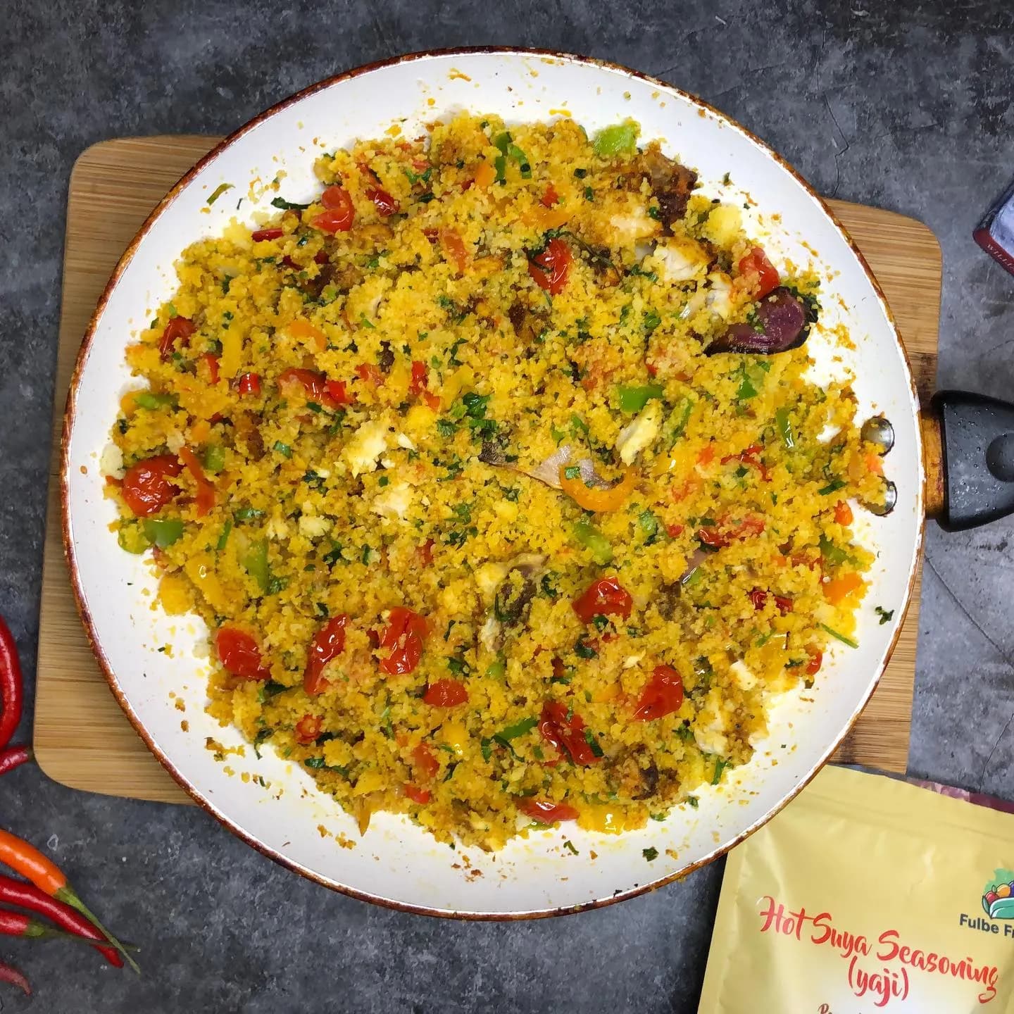 Dambu, a Hausa steamed maize grits dish with shredded meat, groundnuts and spring onions