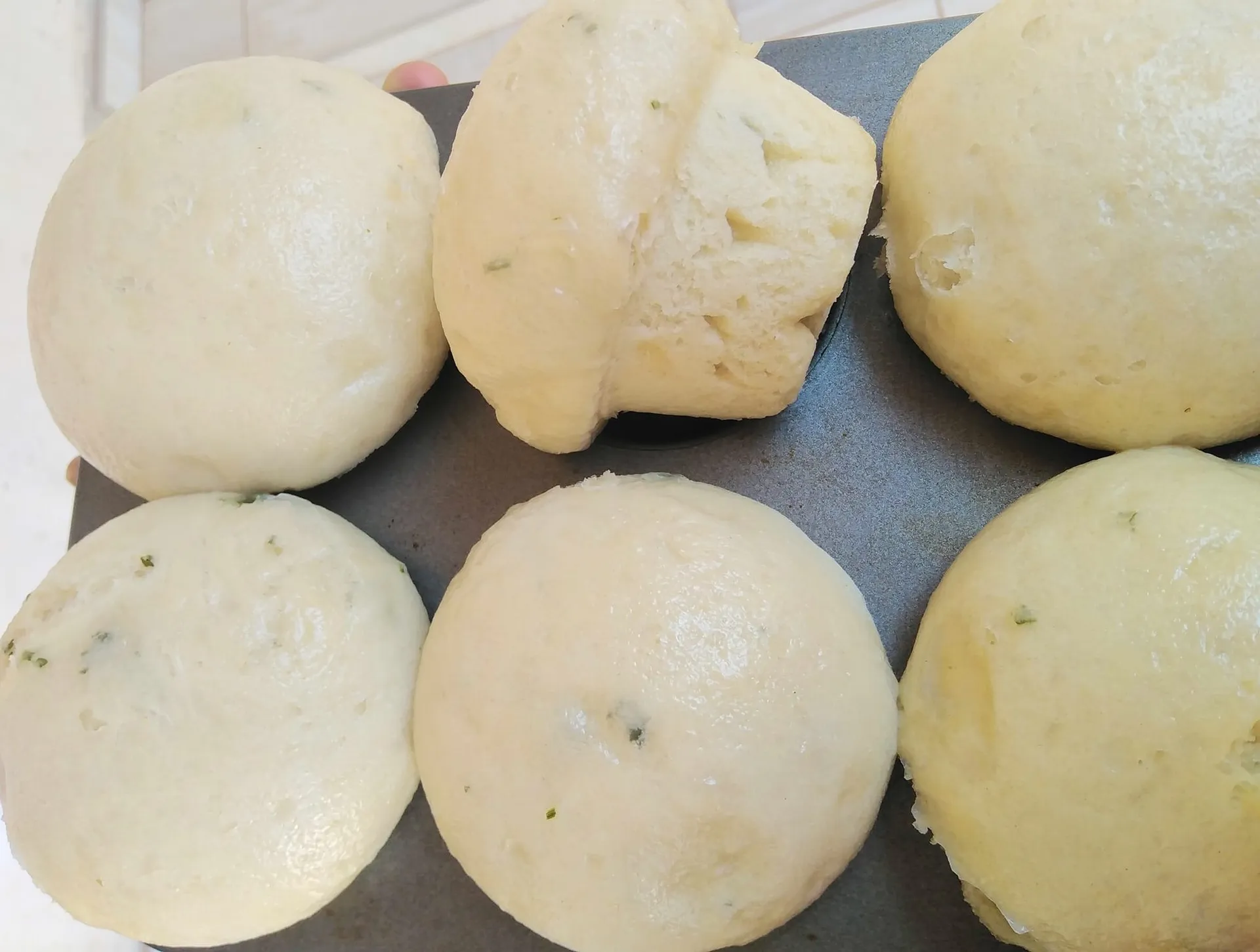 Dombolo, a South African steamed bread, cut into wedges and served with stew