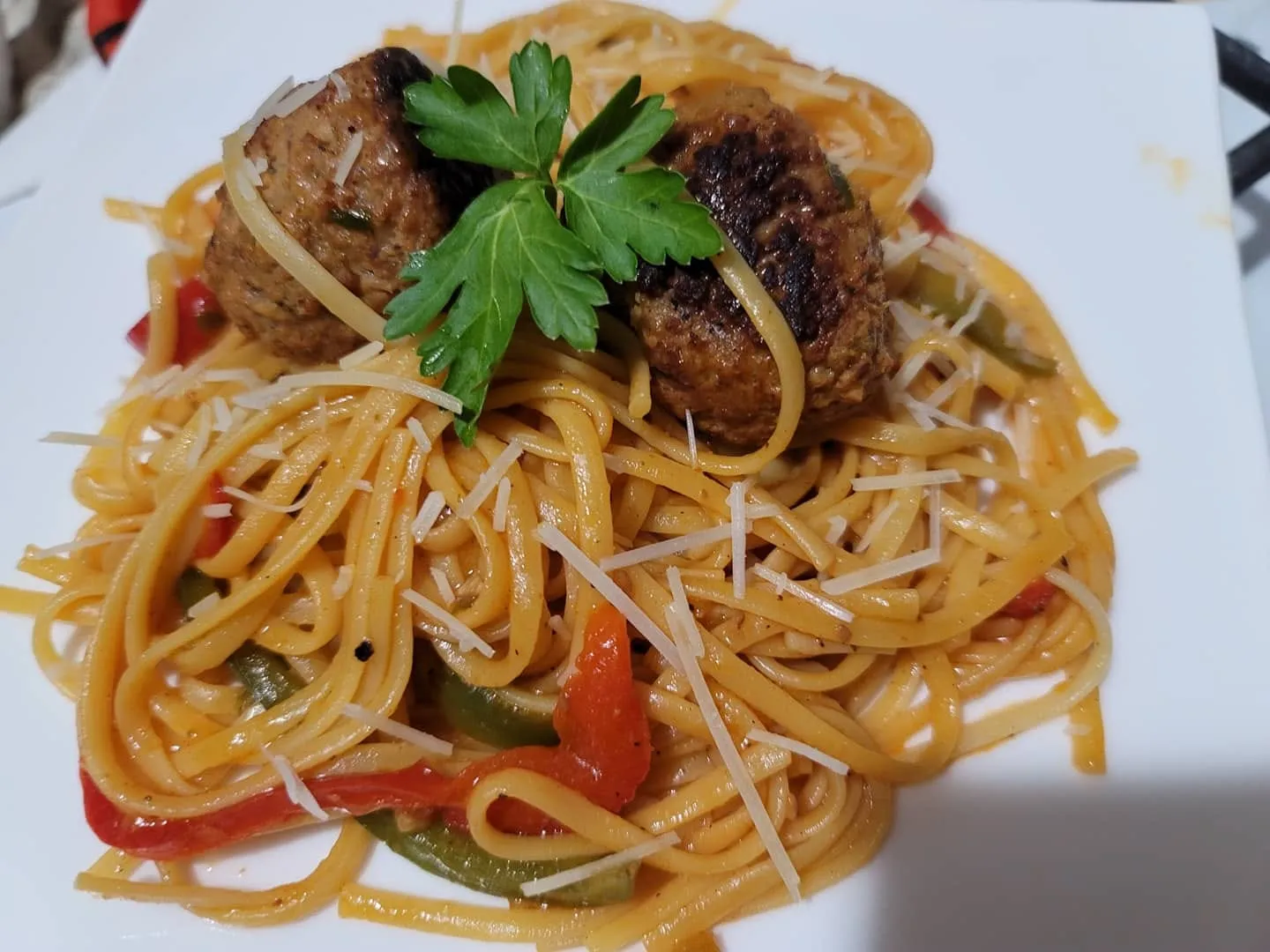 Dominican spaghetti in a tomato sofrito sauce with olives, capers and raisins