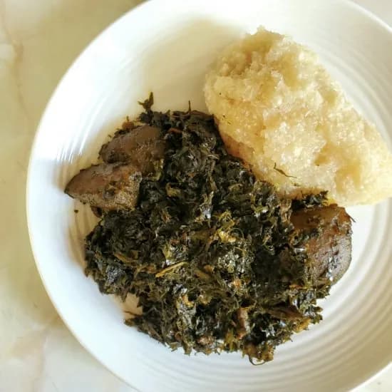 Eru soup, Cameroonian shredded wild leaves cooked with palm oil and fish