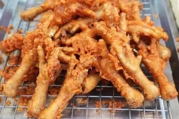 Crispy fried chicken feet, deep fried to golden brown and served as a snack