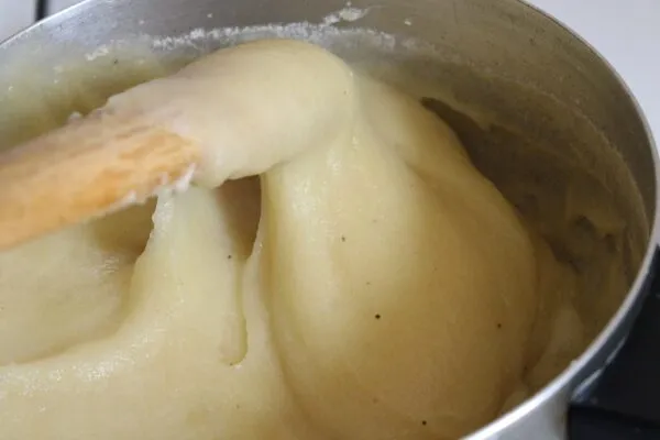 Fufu, a smooth elastic West African starch staple shaped into a ball and served with soup
