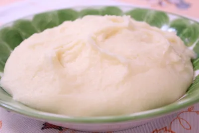 Funge, an Angolan cassava porridge, shaped into a smooth mound and served warm