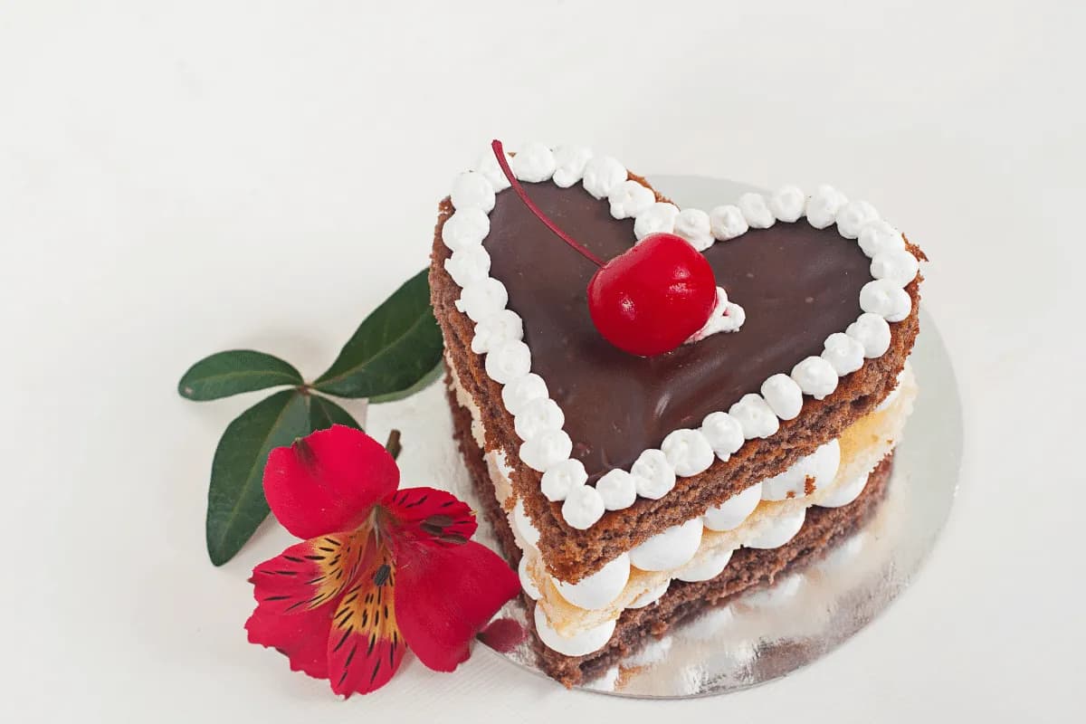 A heart-shaped chocolate layer cake with buttercream frosting