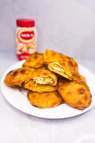 Homemade chicken mayo pies, baked golden hand pies filled with shredded chicken and mayonnaise