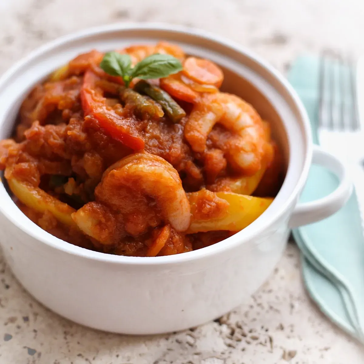 Cameroonian potato hot pot with browned potatoes, vegetables and shrimp