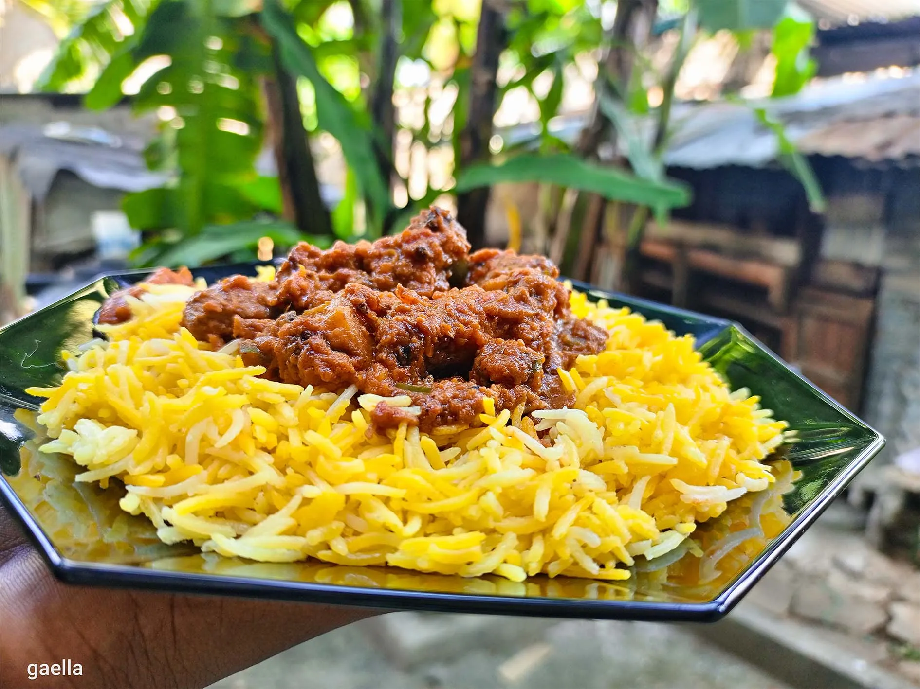 Kenyan beef biryani, layered spiced beef and basmati rice with fried onions and potatoes