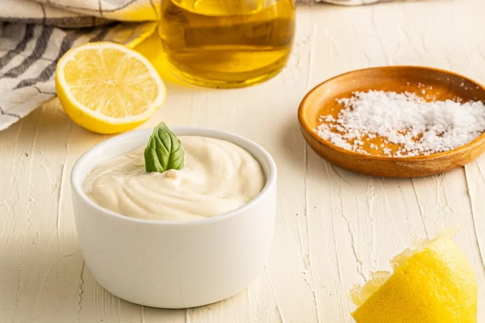 Homemade mayonnaise whisked from egg yolk, lemon and oil