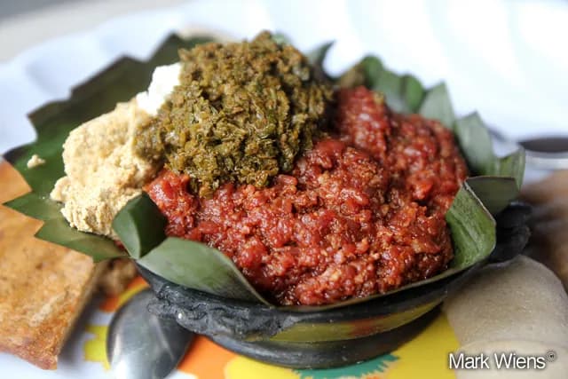 Kitfo, Ethiopian minced raw beef with spiced butter, served with injera