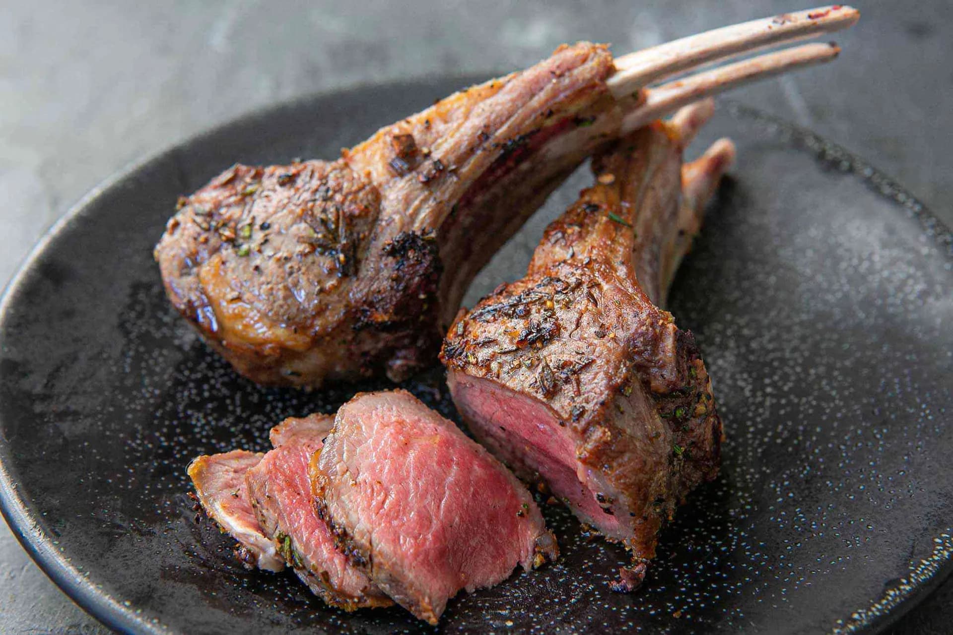 Lamb steaks rubbed with garlic and chilli, roasted on a rack