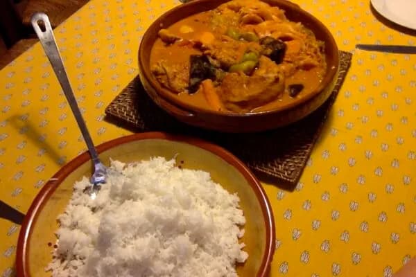 Maafe, a West African groundnut stew with beef and vegetables, served over white rice