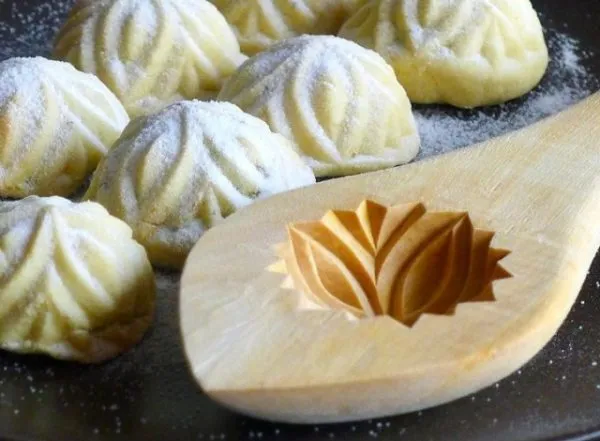 Maamoul, semolina cookies filled with walnuts and dusted with icing sugar