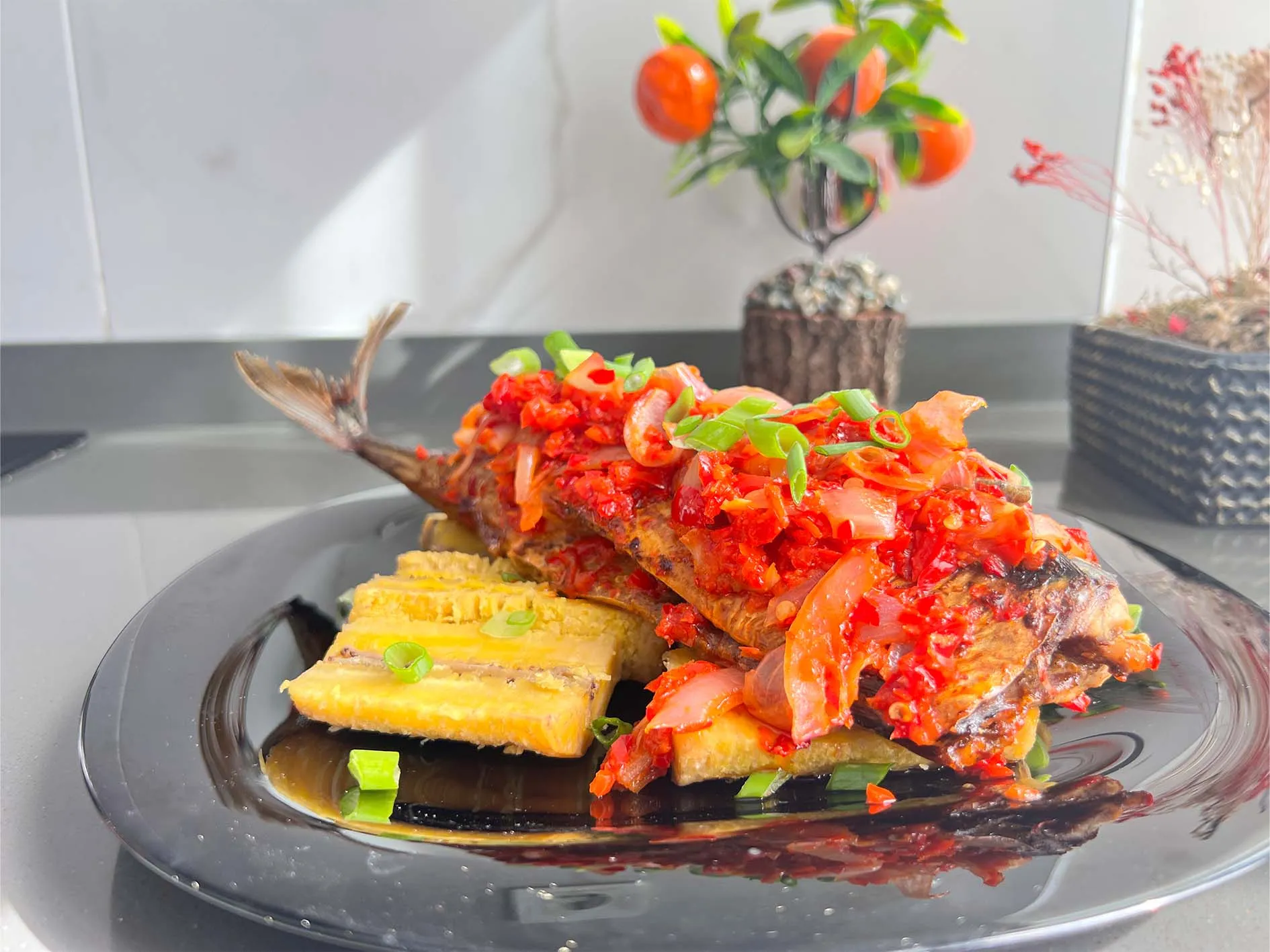 Grilled mackerel in a Nigerian red pepper and onion sauce