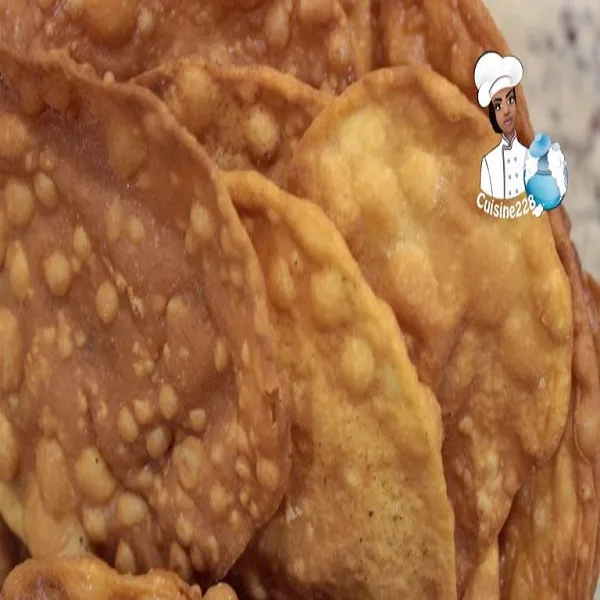 Merveilles, thin crisp strips of fried sweet dough dusted with icing sugar