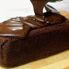 Milo cake, a malted chocolate cake topped with whipped cream and chocolate sprinkles