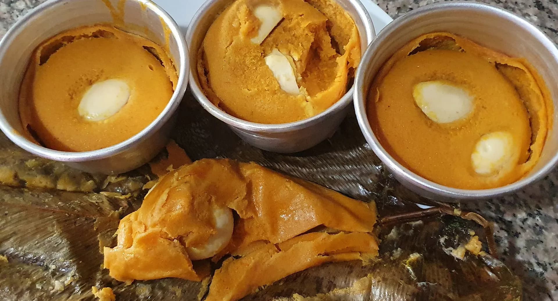 Moi moi, Nigerian steamed bean pudding wrapped in leaves with a boiled egg inside