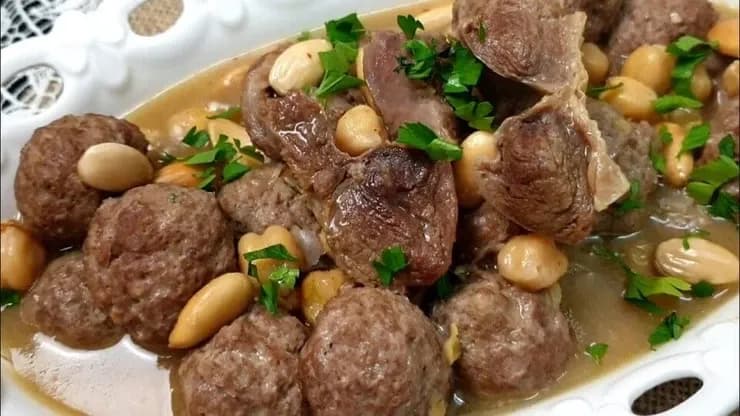 Mtewem, an Algerian dish of garlic meatballs and beef cooked with chickpeas