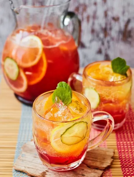 Nigerian chapman, a red soft drink cocktail with cucumber, lime and mint
