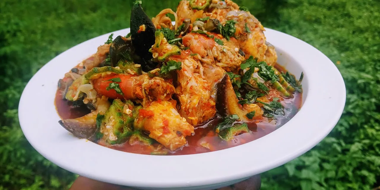 Nigerian Fisherman Soup, a seafood soup from Akwa Ibom and Cross River, served with pounded yam