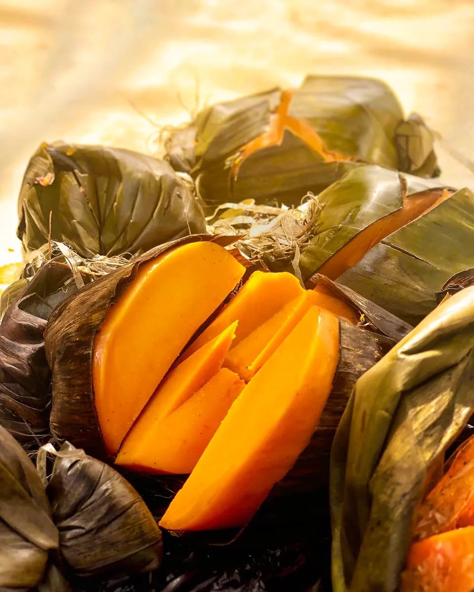 Okpa, Nigerian steamed Bambara nut pudding with palm oil, wrapped and set solid