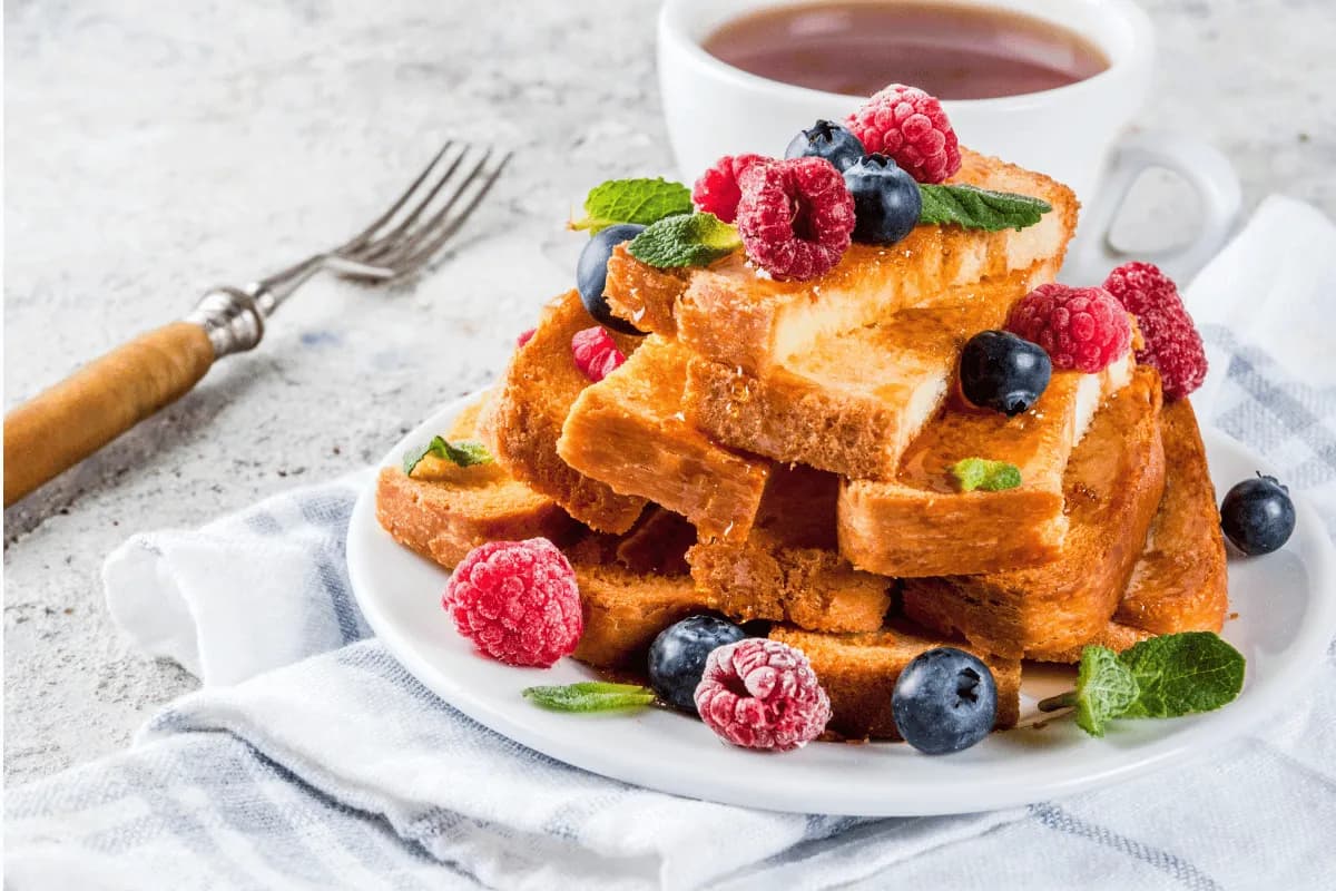 Oven-baked French toast in a dish, puffed and golden