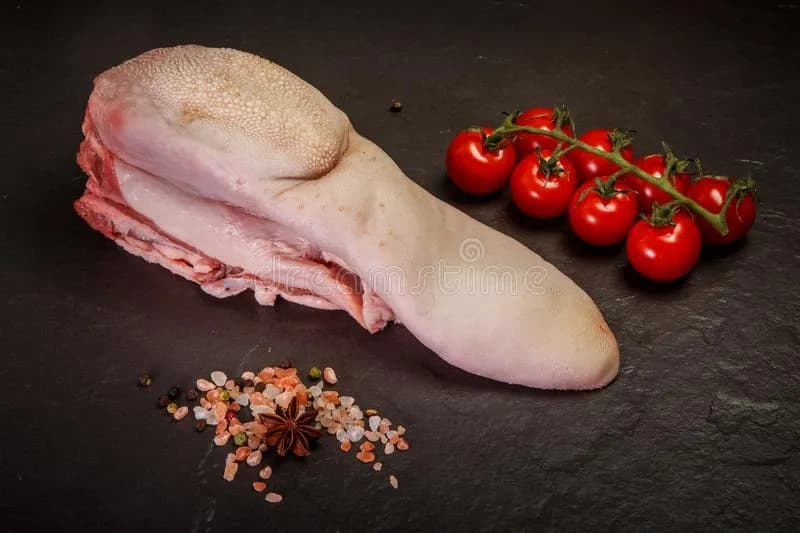 Ox tongue simmered with aromatics, peeled and sliced for serving