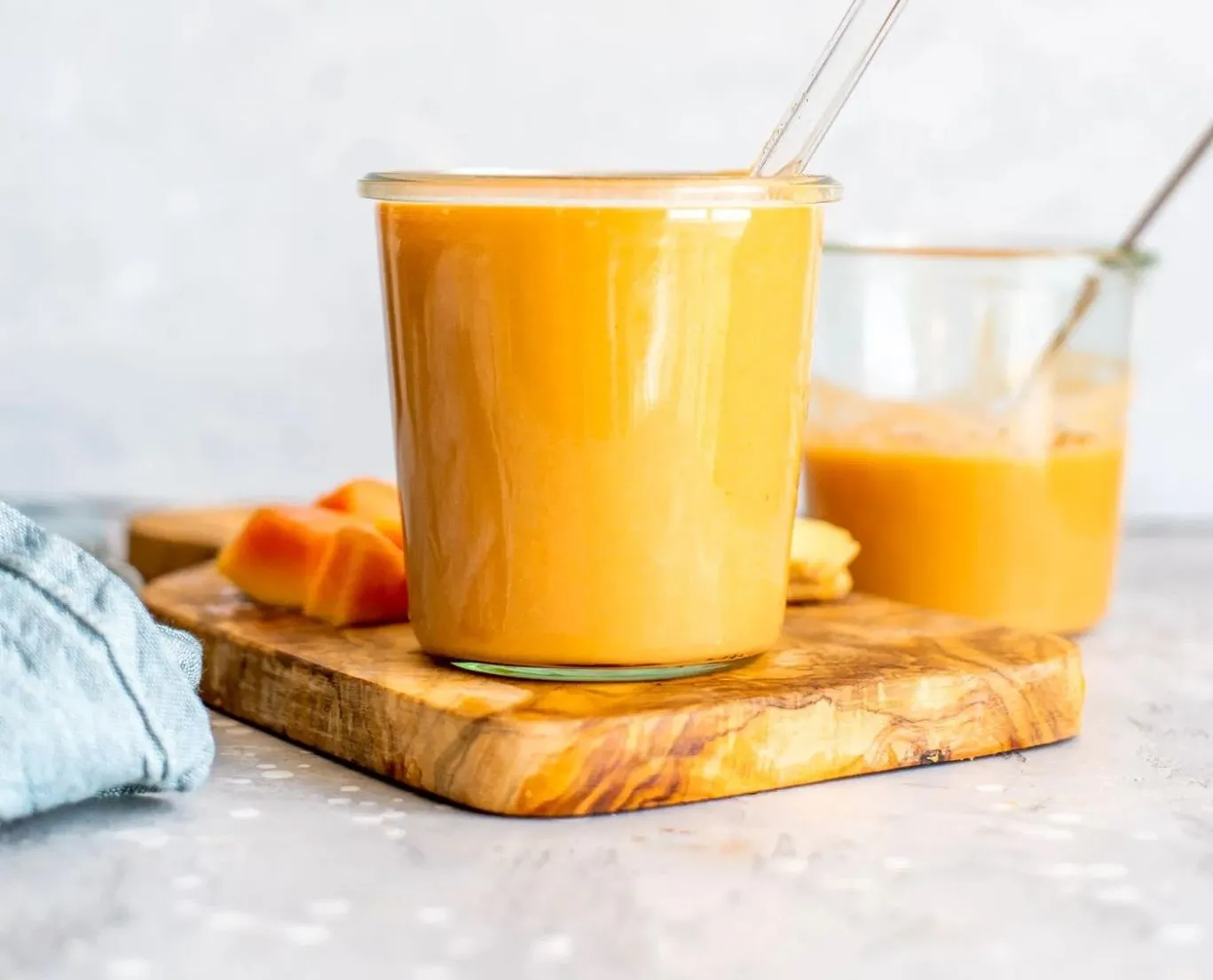 Papaya smoothie in a glass, blended with banana, yogurt and chia seeds