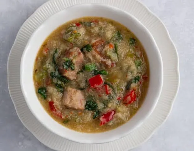 Pate, a Northern Nigerian one pot grain porridge with kenaf leaf, meat and groundnut