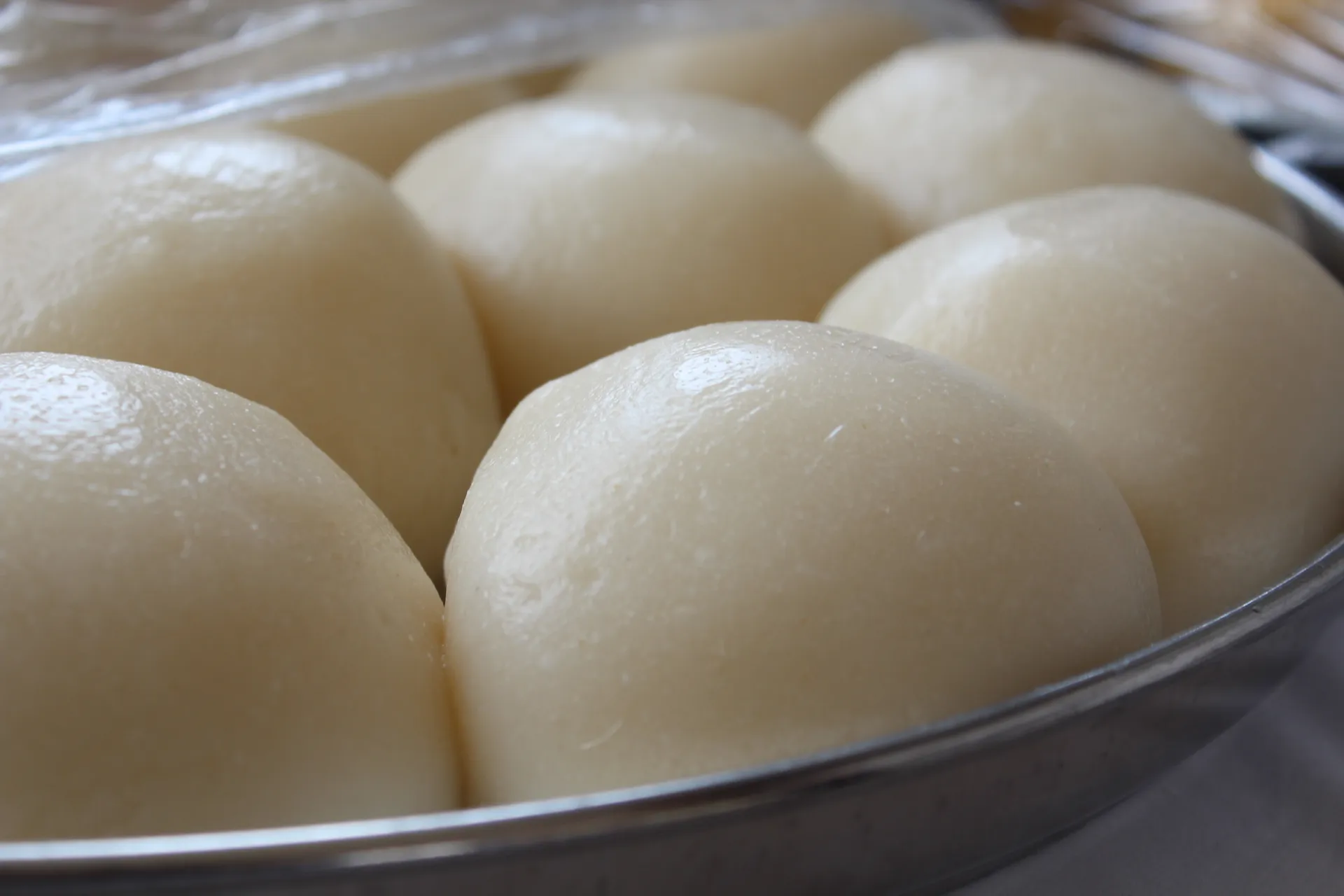 Smooth balls of placali in a metal tray