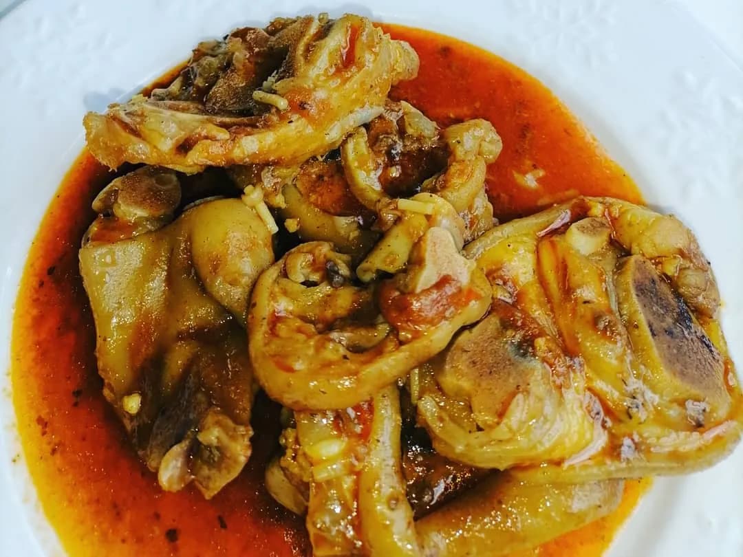 Pork trotters, a South African dish slow cooked until tender and served with pap