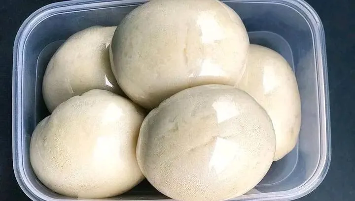 Nigerian pounded yam, a smooth elastic white yam swallow served with soup