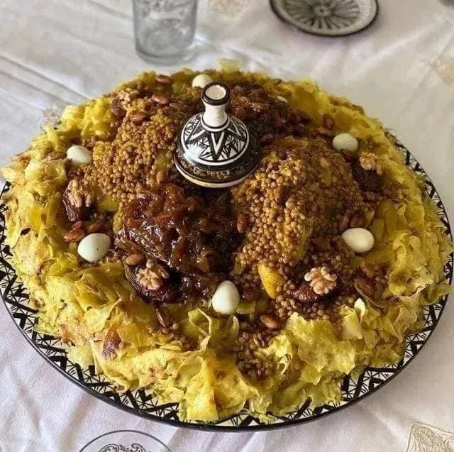 Moroccan chicken rfissa, chicken and lentils in fenugreek broth served over shredded msemen pastry