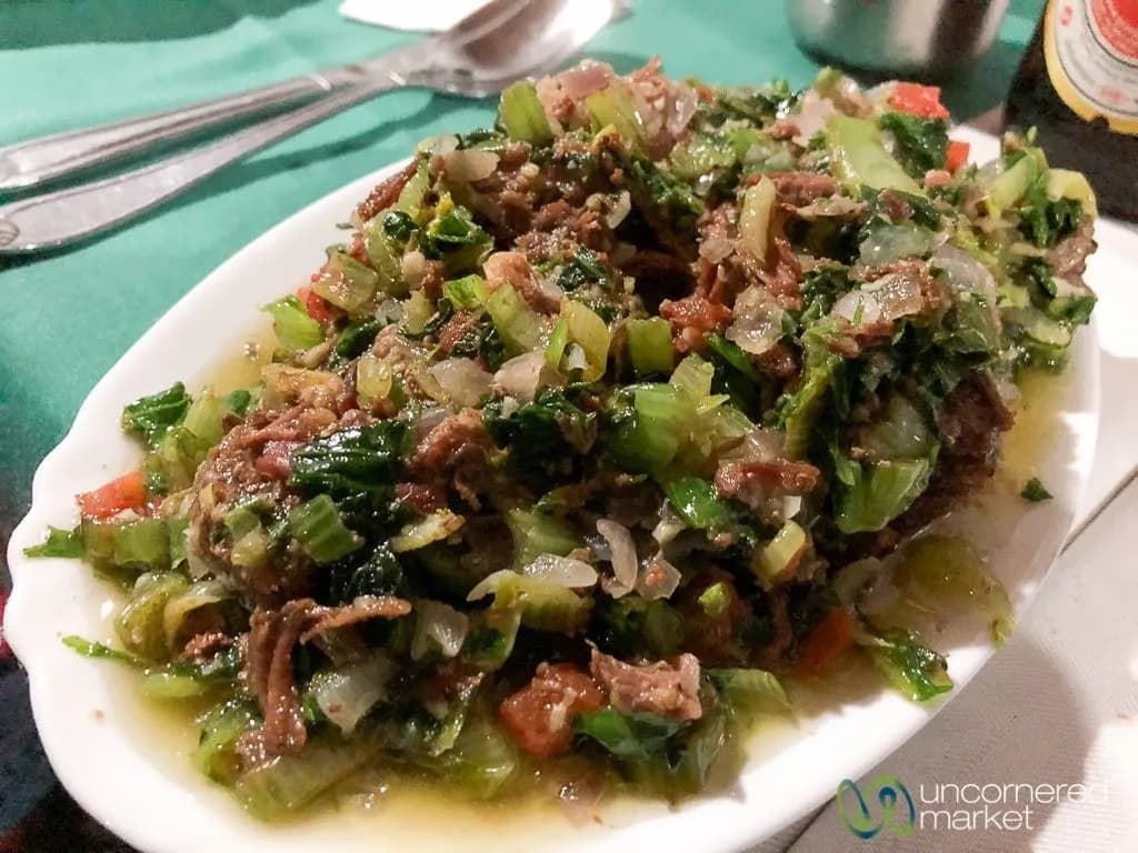 Romazava, the Malagasy national dish of beef, pork and chicken simmered with greens