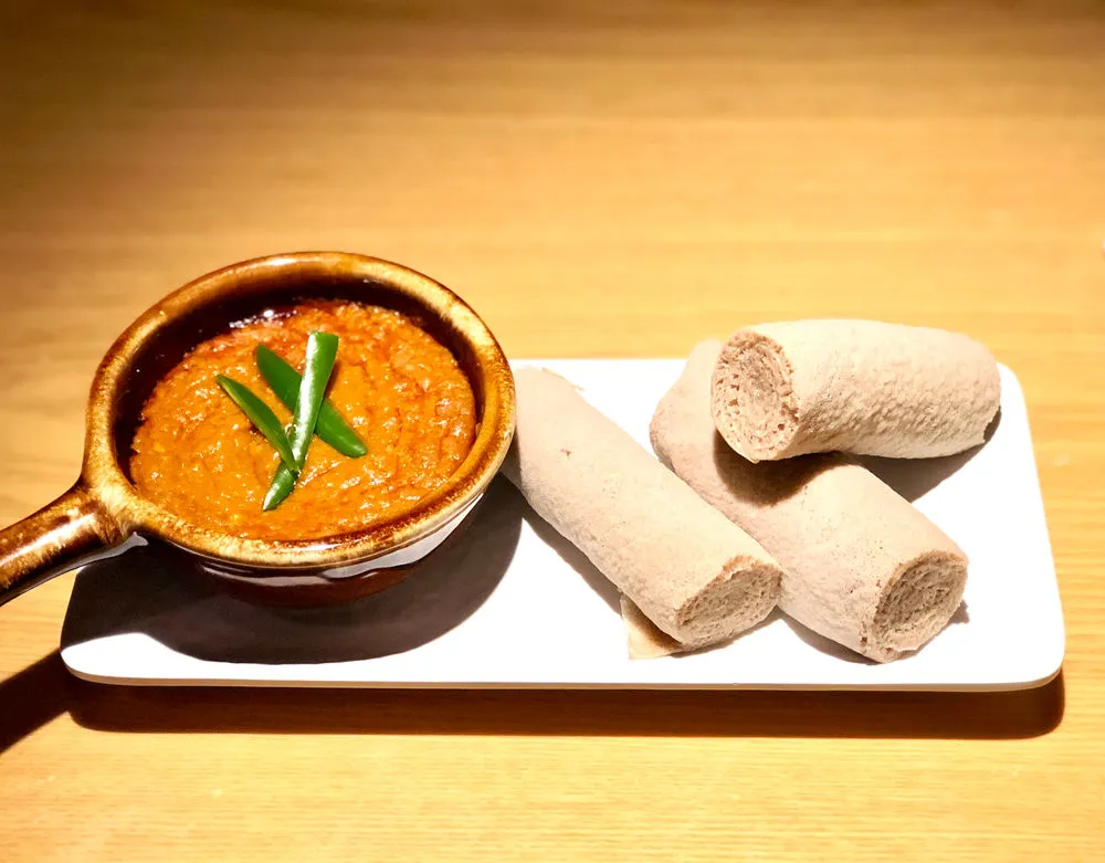 Shiro wat, an Ethiopian stew of ground chickpeas with berbere, served on injera