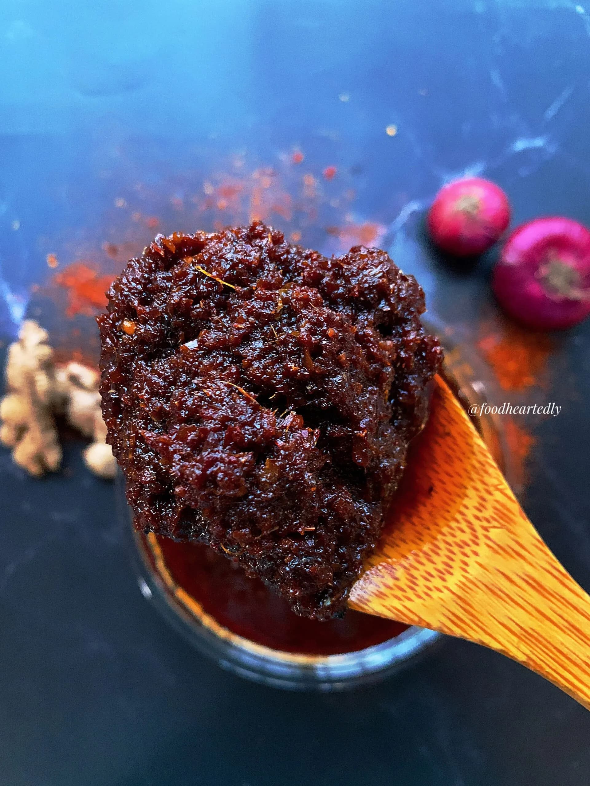 Shito, the Ghanaian black pepper sauce of dried fish, shrimp and pepper cooked in oil, in a glass jar