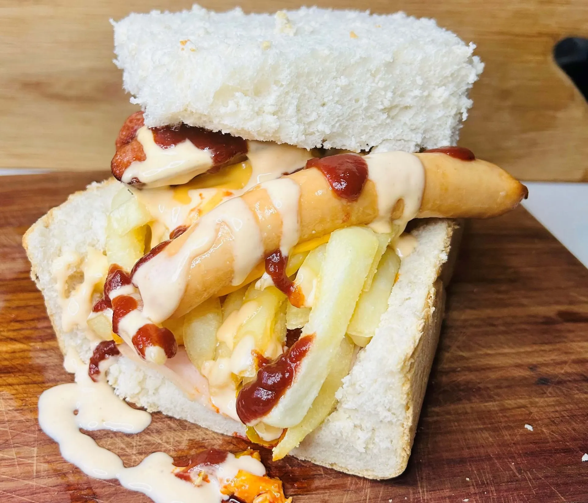 A South African kota, a quarter loaf of bread filled with chips, russian sausage, cheese and atchar