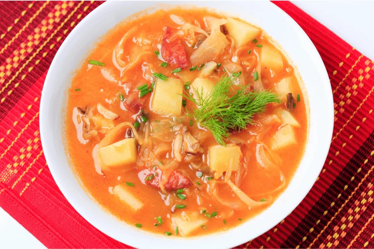 Spicy cabbage and beef soup with tomatoes and vegetables