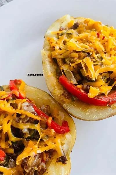 Stuffed potatoes filled with spiced mince and topped with melted cheese