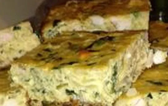 Tajin sibnekh, a Tunisian baked egg dish with chicken, potato, spinach and harissa