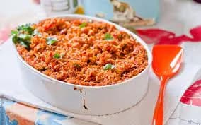 Pan-toasted jollof rice cooked in a spiced Nigerian tomato stew